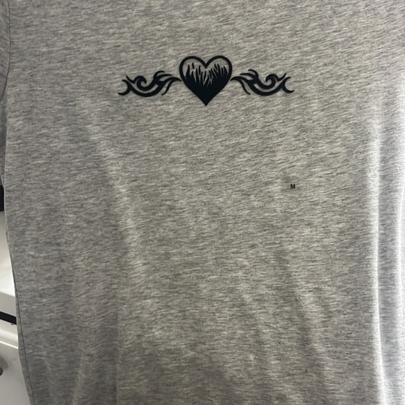 Never used, size M plain gray with a black design on the shirt. - Picture 3 of 3